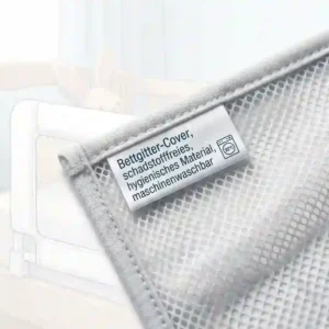 Detail view of a bettgitter hygienisches material cover showing non-toxic and washable quality.